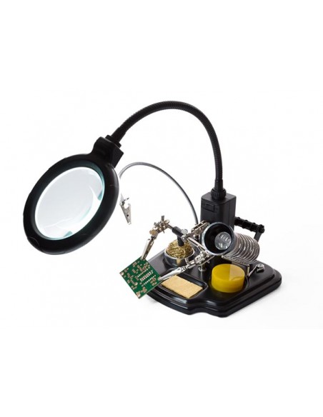 Troisieme main avec loupe et outils de soudage